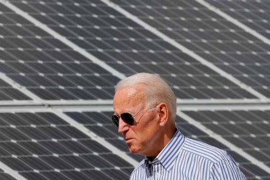 Democratic 2020 U.S. presidential candidate and former Vice President Joe Biden walks past solar panels while touring the Plymouth Area Renewable Energy Initiative in Plymouth, New Hampshire, U.S., June 4, 2019.   REUTERS/Brian Snyder/File Photo