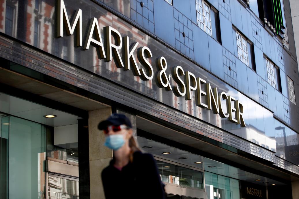 A woman walks past a Marks & Spencer store on Oxford Street, amid the outbreak of the coro<em></em>navirus disease (COVID-19), in London, Britain, July 20, 2020. REUTERS/Henry Nicholls