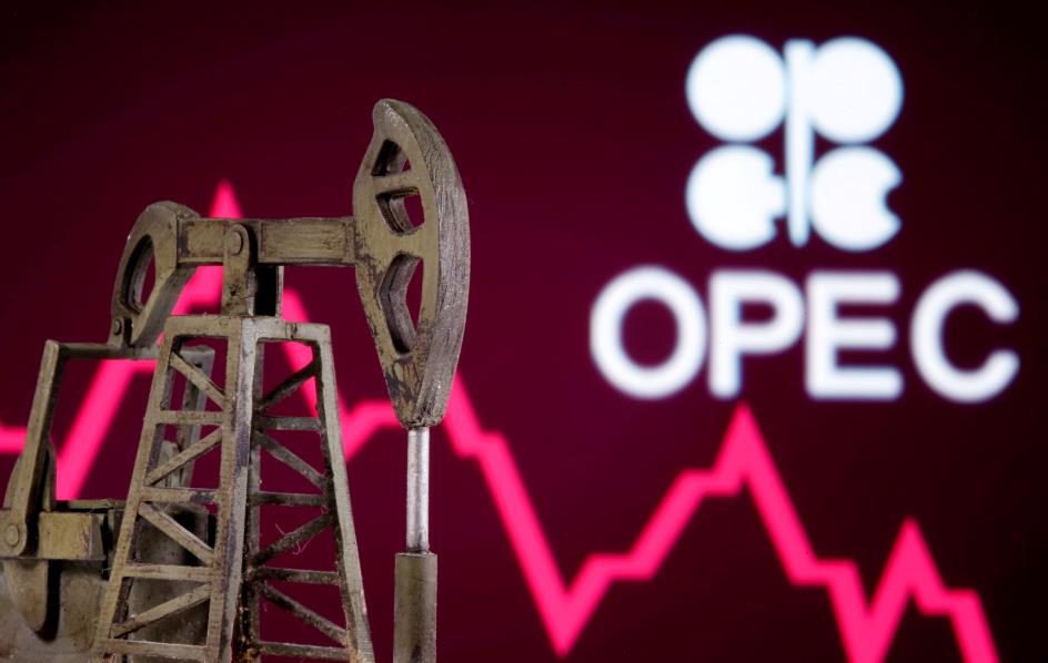 A 3D printed oil pump jack is seen in front of displayed stock graph and Opec logo in this illustration picture, April 14, 2020. REUTERS/Dado Ruvic/Illustration/File Photo