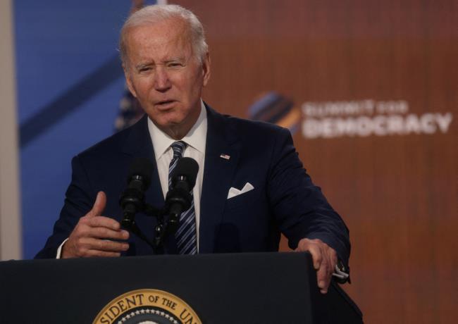 U.S. President Joe Biden delivers closing remarks with leaders from democratic nations at the State Department's virtual Summit for Democracy, in a speech from the Eisenhower Executive Office Building's South Court Auditorium at the White House in Washington, U.S., December 10, 2021. REUTERS/Leah Millis/Files