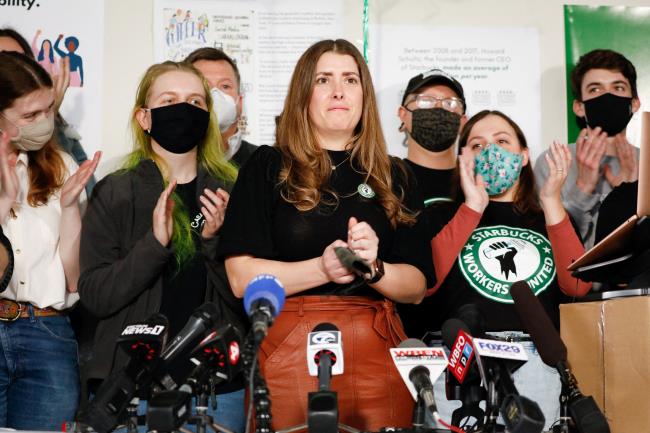 Starbucks workers react as they speak to the media after unio<em></em>n vote in Buffalo, New York, U.S., December 9, 2021.  REUTERS/Lindsay DeDario
