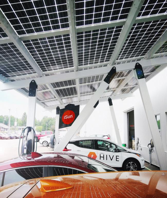 A Hive Technologies Inc vehicle is seen at a solar-powered electric vehicle charging station in Los Angeles, California in undated handout photo obtained December 13, 2021.   Hive Technologies Inc/Handout via REUTERS   