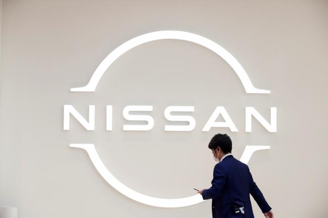 A man walks in front of the Nissan logo at Nissan Gallery in Yokohama, Japan November 29, 2021. REUTERS/Andro<em></em>niki Christodoulou