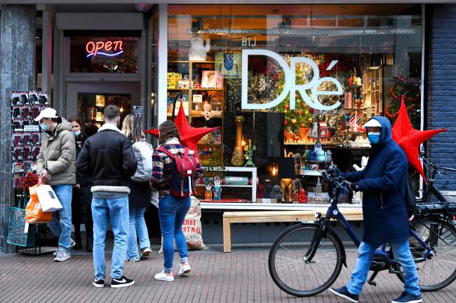People do their Christmas shopping before the Dutch government's expected announcement of a 