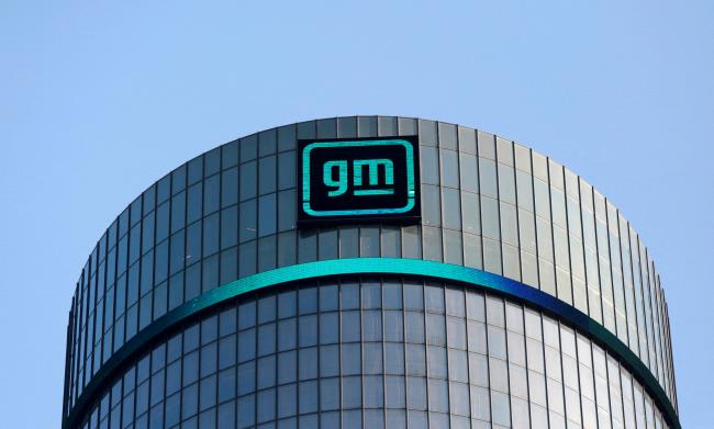 FILE PHOTO: The new GM logo is seen on the facade of the General Motors headquarters in Detroit, Michigan, U.S., March 16, 2021. REUTERS/Rebecca Cook/File Photo/File Photo