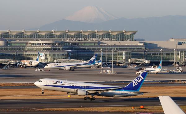 ANA's Boeing 767 takes off in front of Mt. Fuji at the Tokyo Internatio<em></em>nal Airport in Tokyo