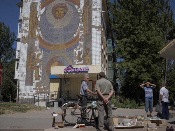 People sell their goods at the market in Kostiantynivka