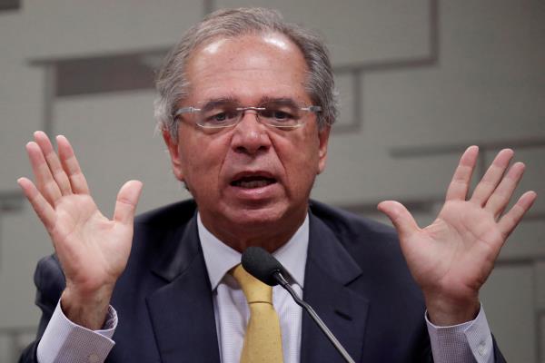 Brazil's Eco<em></em>nomy Minister Paulo Guedes gestures during a meeting at Eco<em></em>nomic Affairs Committee (CAE) of the Brazilian Federal Senate in Brasilia