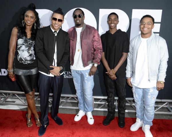 Sean Combs, also known as Diddy, posing with his late girlfriend Kim Porter and sons Quincy Brown, Christian Casey Combs, and Justin Dior Combs at the premiere of 'DOPE' in Los Angeles