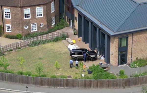 A woman in her 40s has been arrested on suspicion of causing death by dangerous driving after a Land Rover Defender crashed into a girls' prep school building.