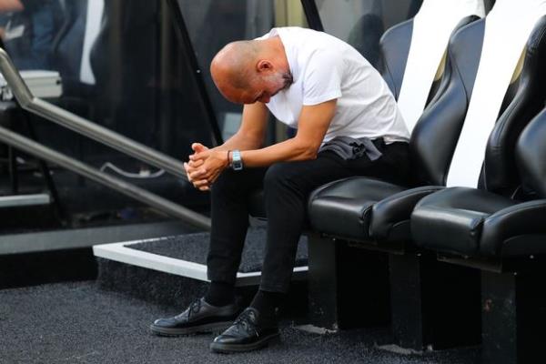 NEWCASTLE UPON TYNE, ENGLAND - AUGUST 21: Pep Guardiola, manager of Manchester City, looks dejected during the Premier League match between Newcastle United and Manchester City at St. James Park on August 21, 2022 in Newcastle upon Tyne, England.