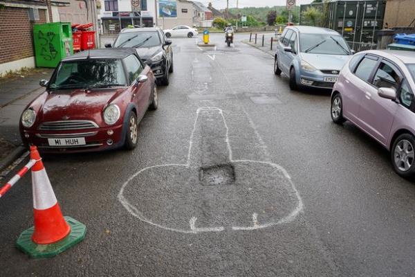 The crude phallus-shaped drawings have been pictured around two potholes