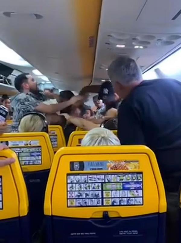Passengers had to pull the two men apart