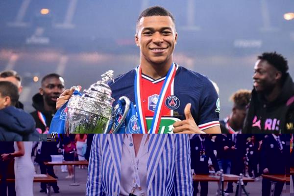 TOPSHOT - Paris Saint-Germain's French forward Kylian Mbappe celebrates with the trophy after winning the French Cup final football match between Paris Saint-Germain and Mo<em></em>naco at the Stade de France stadium, in Saint-Denis, on the outskirts of Paris, on May 19, 2021