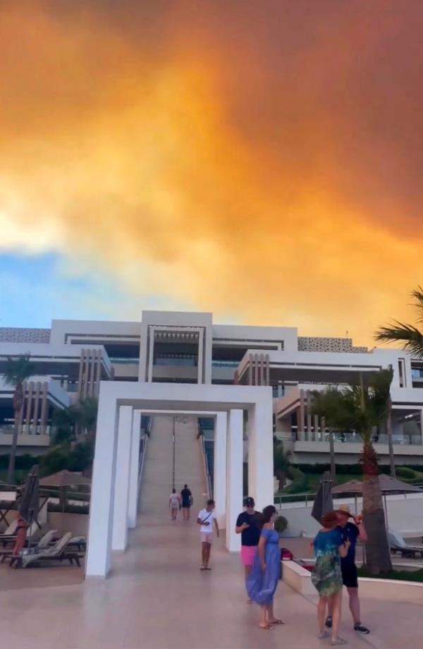 Mayia Exclusive Resort & Spa in Kiotari village enveloped by flames and smoke