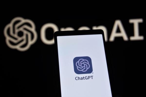 ChatGPT logo on a smartphone screen. OpenAI logo is visible in the background.