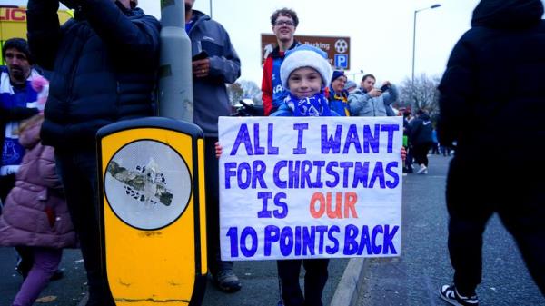 File pic: PA
File photo dated 26-11-2023 of An Everton fan holds up a sign in protest of the club&#39;s point deduction. Everton???s 10-point deduction for breaching profitability and sustainability rules has been reduced to six following an appeal, the Premier League has announced. Issue date: Mo<em></em>nday February 26, 2024.
