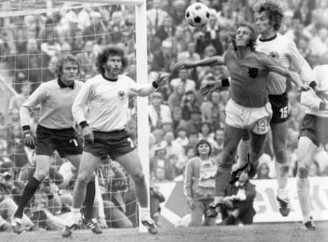 West Germany goalkeeper Sepp Maier and Paul Breitner look on as their teammate Rainer Bo<em></em>nhof and the Netherlands’ Johan Neeskens go up for a header during the 1974 World Cup final.