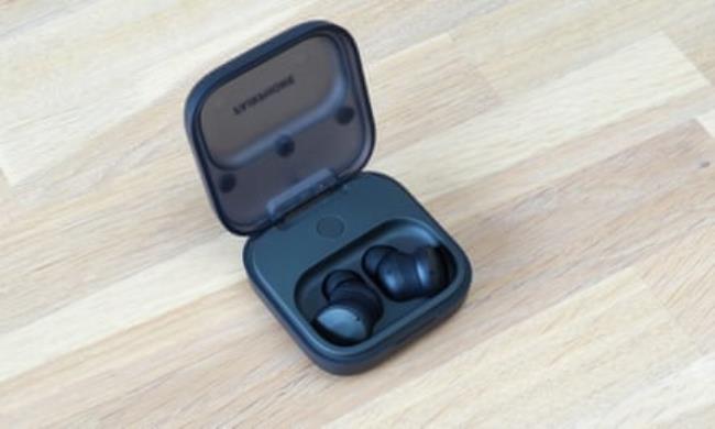 The Fairphone Fairbuds charging in their case.