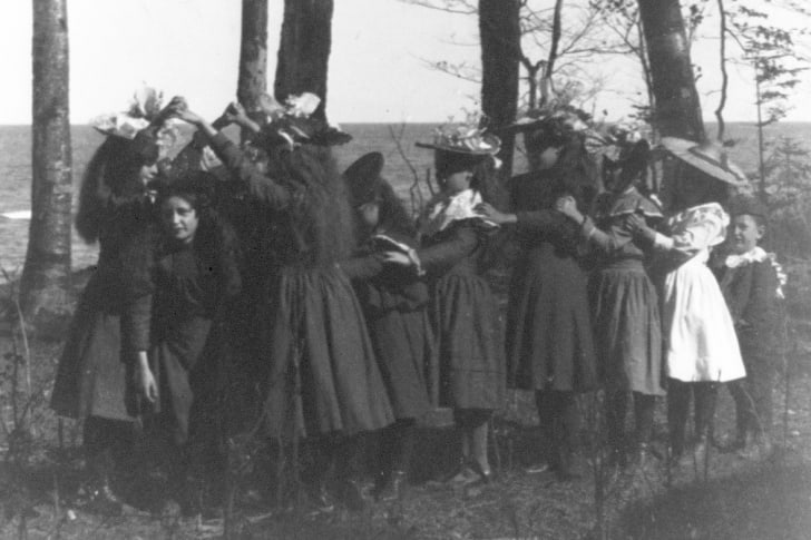 black and white photo of girls playing "Lo<em></em>ndon Bridge Is Falling Down"