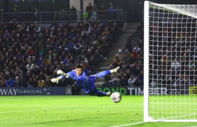 Michael Cooper saves a shot for Plymouth