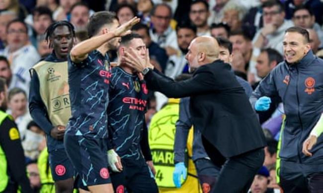 Pep Guardiola clutches Phil Foden’s face after that goal in Madrid.