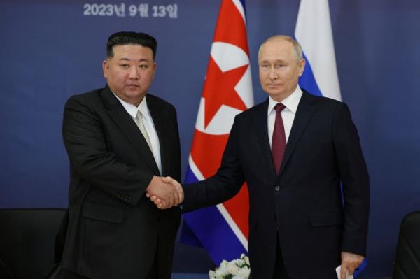 Russia's President Vladimir Putin shakes hands with North Korea's leader Kim Jong Un during a meeting at the Vostochny Сosmodrome in the far eastern Amur region, Russia