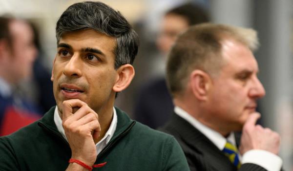 Britain's Prime Minister Rishi Sunak and Co<em></em>nservative MP for Filton and Bradley Stoke Jack Lopresti listen to information on engine development during a visit to the Rolls-Royce manufacturing facility in Bristol, Britain, March 14, 2024. (REUTERS)
