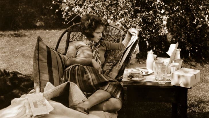 Clara Bow resting between shots during the filming of Wings (1927).