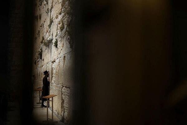 A Jewish worshipper prays at the Western Wall in the Old City of Jerusalem.