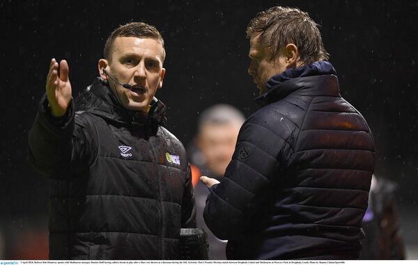 5 April 2024; Referee Rob Hennessy speaks with Shelbourne manager Damien Duff havin<em></em>g called a break in play after a flare was thrown at a linesman during the SSE Airtricity Men's Premier Division match between Drogheda United and Shelbourne at Weavers Park in Drogheda, Louth. Photo by Shauna Clinton/Sportsfile