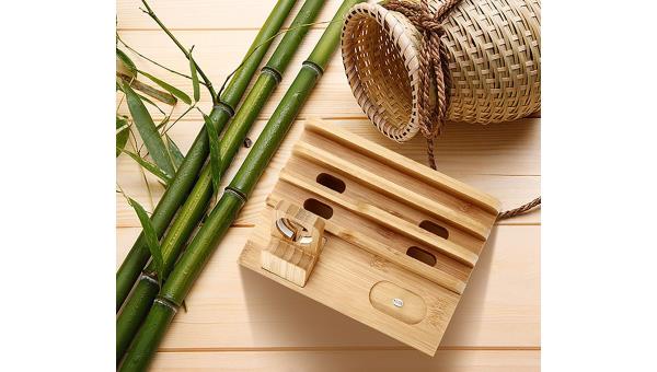A Sendowtek Bamboo 6 in 1 Charging Station is placed between bamboo and a basket.