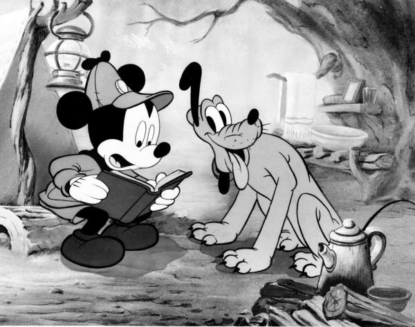 A 1946 drawing of Mickey Mouse and Pluto, reading a book, related to the co<em></em>ntroversy over the extension of copyright terms