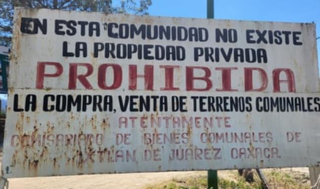 A sign outside Ixtlán sawmill and furniture factory reads: ‘In this community, private property does not exist. The purchase or sale of communal land is forbidden.’