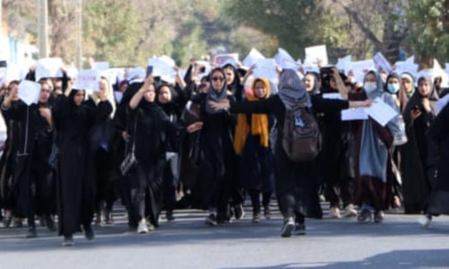 Female students chant ‘Education is our right, genocide is a crime’ during a protest in Herat, Afghanistan in 2022. 