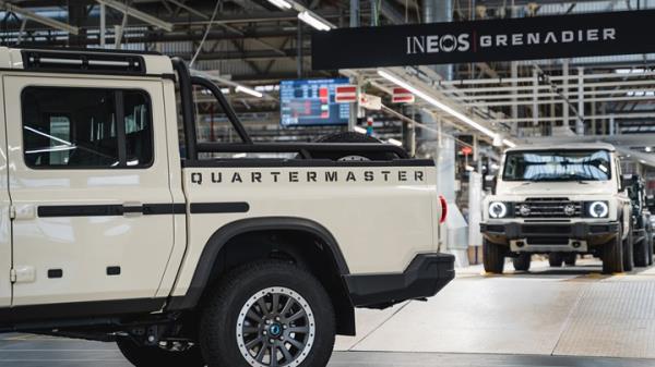 Ineos Quartermaster: front three quarter static, silver paint, atop a mountain, sunset