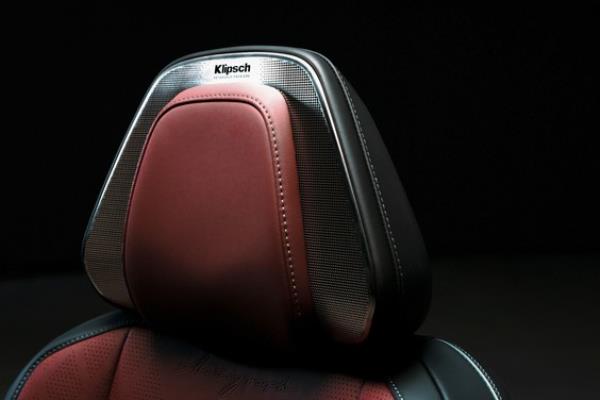 2025 Infiniti QX80 teaser image showing off Klipsch headrest speakers
