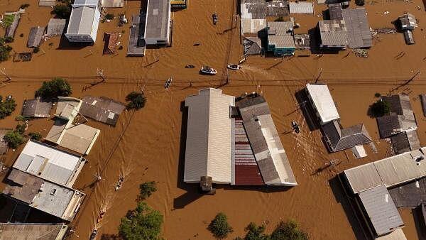 A drone view shows boats with volunteers searching for people isolated at houses, at the flooded neighborhood of Mathias Velho in Canoas, at the Rio Grande do Sul state, Brazil.