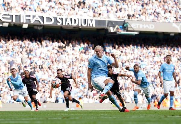 Manchester City's Erling Haaland scores their side's fourth goal of the game from a penalty during the Premier League match at the Etihad Stadium, Manchester