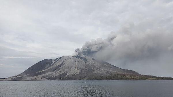 Indonesia’s Mount Ruang volcano spews more hot clouds