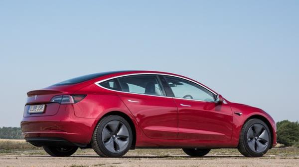 Rear three quarters of the first UK right-hand drive Tesla Model 3