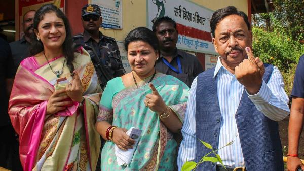 Unio<em></em>n Minister Narayan Rane and his family members show their fingers marked with indelible ink after casting their vote for the third phase of Lok Sabha polls, in Ratnagiri, Maharashtra.