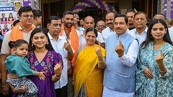 Unio<em></em>n Minister and BJP leader Pralhad Joshi and his family members show their inked fingers after casting their vote during the third phase of Lok Sabha polls, in Hubballi.