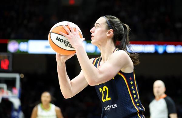 Caitlin Clark shoots during the Fever's preseason loss to the Wings on May 3, 2024. 