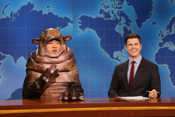 Bowen Yang as Moo Deng the hippo and Colin Jost during Weekend Update on Saturday. 