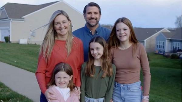Republican Derrick Anderson, who is running for Virginia's seventh co<em></em>ngressional district, poses in a photo with a family that is not his.