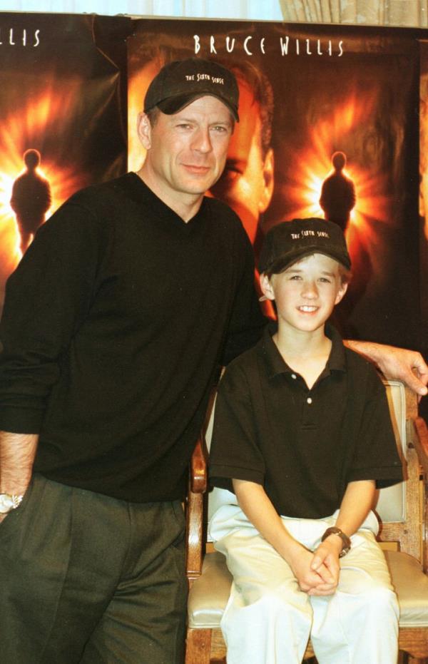 Bruce Willis, left, and Haley Joel Osment are seen at a preview of the film 