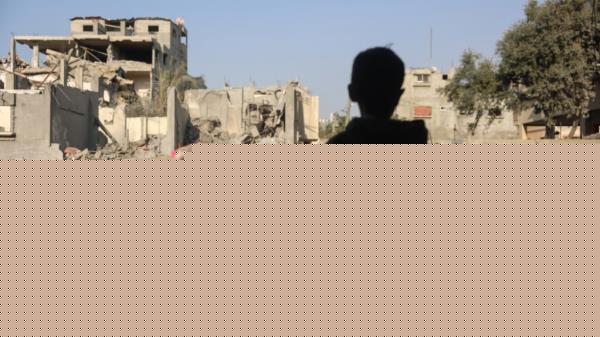 Children stare at the destruction following an Israeli strike in the Nuseirat refugee camp in the central Gaza Strip on Nov. 7, 2024.