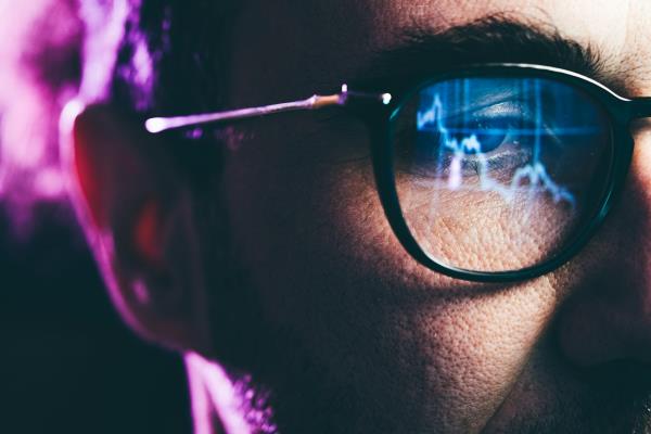 Close-up portrait of man working on computer.