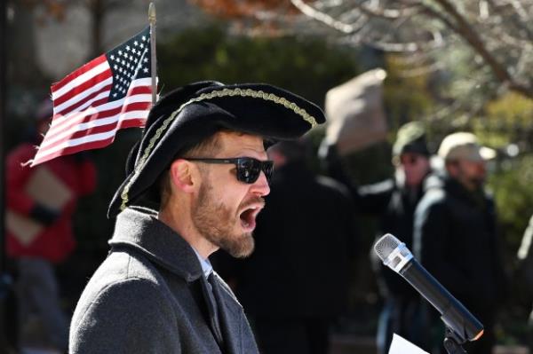 Rally marshal, emcee and self described "town crier" Erik Berg speaks to the crowd. Protesters rally on President's Day at Lawyers Mall in Annapolis against the policies of President Do<em></em>nald Trump and Elon Musk as part of the natio<em></em>nwide "50501" Movement. (Paul W. Gillespie/Staff)